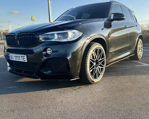 Черный БМВ Х5, объемом двигателя 3 л и пробегом 178 тыс. км за 34500 $, фото 1 на Automoto.ua