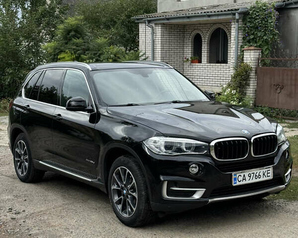 Черный БМВ Х5, объемом двигателя 3 л и пробегом 170 тыс. км за 32500 $, фото 1 на Automoto.ua