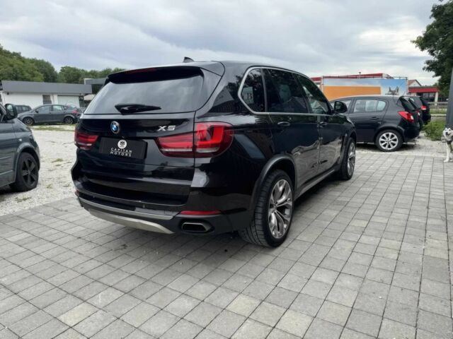 Чорний БМВ Х5, об'ємом двигуна 3 л та пробігом 73 тис. км за 11000 $, фото 3 на Automoto.ua