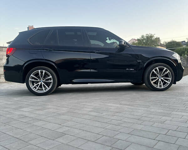 Чорний БМВ Х5, об'ємом двигуна 3 л та пробігом 320 тис. км за 25950 $, фото 1 на Automoto.ua