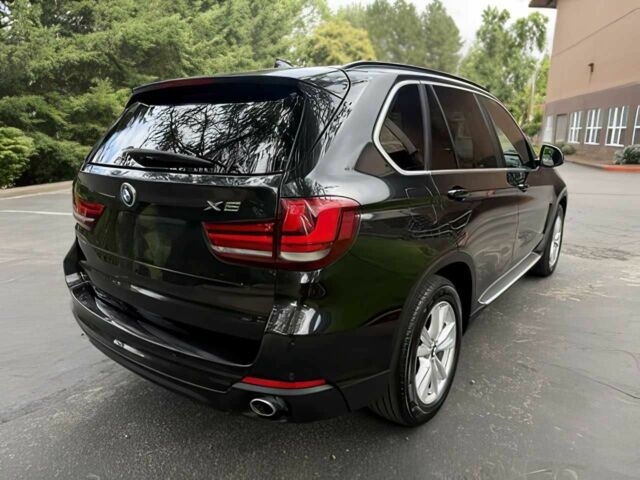 Чорний БМВ Х5, об'ємом двигуна 3 л та пробігом 75 тис. км за 25000 $, фото 4 на Automoto.ua