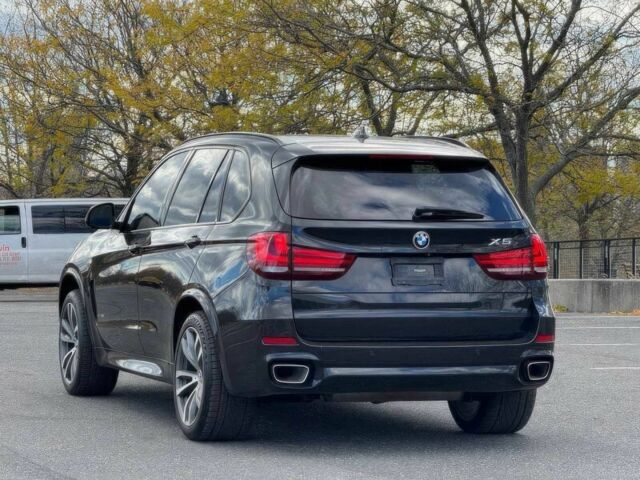 Чорний БМВ Х5, об'ємом двигуна 3 л та пробігом 71 тис. км за 15000 $, фото 6 на Automoto.ua