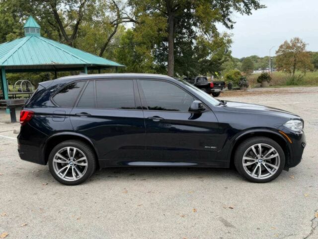 Черный БМВ Х5, объемом двигателя 4.4 л и пробегом 73 тыс. км за 18000 $, фото 3 на Automoto.ua