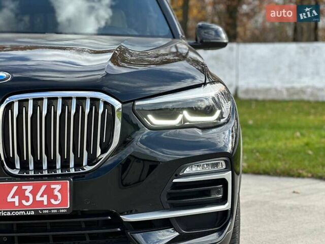 Черный БМВ Х5, объемом двигателя 3 л и пробегом 106 тыс. км за 38200 $, фото 1 на Automoto.ua