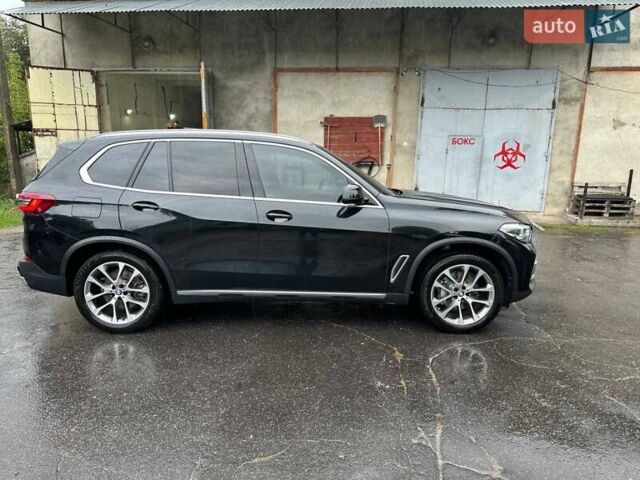 Черный БМВ Х5, объемом двигателя 3 л и пробегом 74 тыс. км за 57500 $, фото 1 на Automoto.ua