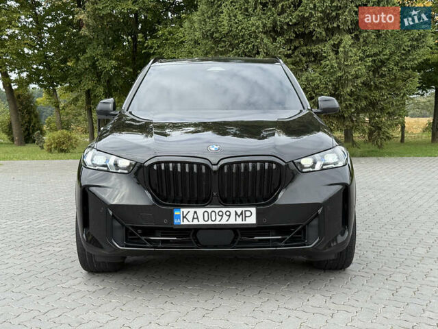 Черный БМВ Х5, объемом двигателя 3 л и пробегом 75 тыс. км за 72800 $, фото 1 на Automoto.ua