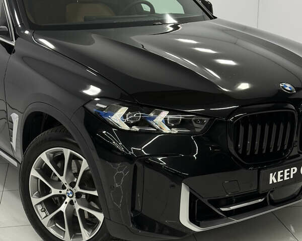 Черный БМВ Х5, объемом двигателя 3 л и пробегом 22 тыс. км за 87900 $, фото 1 на Automoto.ua