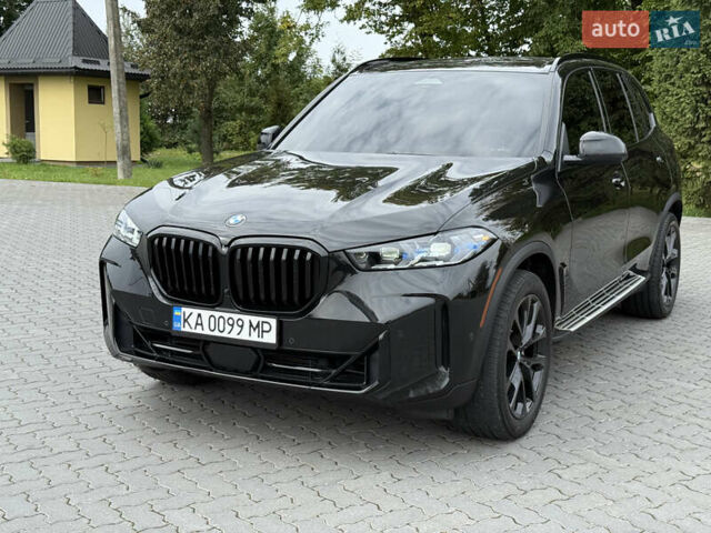 Черный БМВ Х5, объемом двигателя 3 л и пробегом 75 тыс. км за 72800 $, фото 2 на Automoto.ua