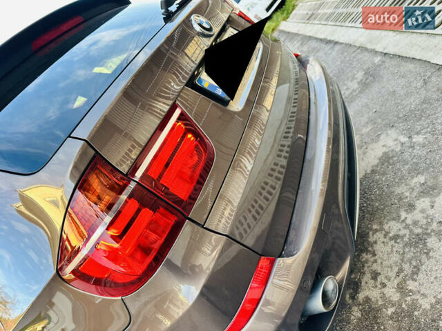 Коричневый БМВ Х5, объемом двигателя 3 л и пробегом 227 тыс. км за 15700 $, фото 5 на Automoto.ua