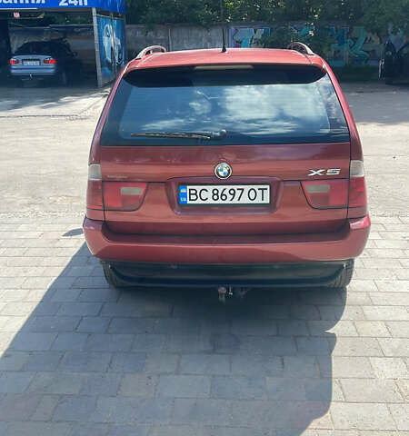 Красный БМВ Х5, объемом двигателя 3 л и пробегом 331 тыс. км за 7600 $, фото 4 на Automoto.ua