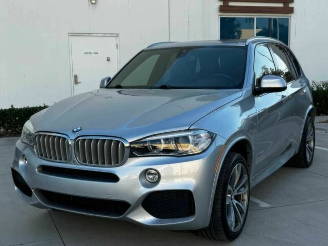 Серый БМВ Х5, объемом двигателя 4.4 л и пробегом 79 тыс. км за 9800 $, фото 2 на Automoto.ua