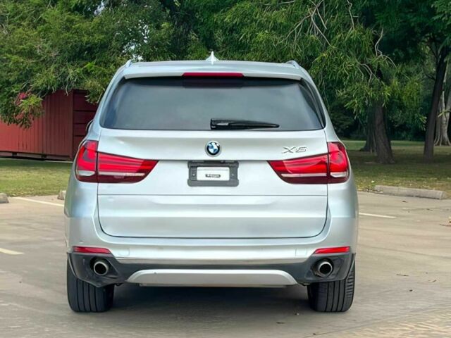 Серый БМВ Х5, объемом двигателя 3 л и пробегом 75 тыс. км за 21500 $, фото 4 на Automoto.ua