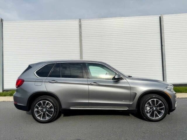 Серый БМВ Х5, объемом двигателя 3 л и пробегом 73 тыс. км за 6800 $, фото 3 на Automoto.ua