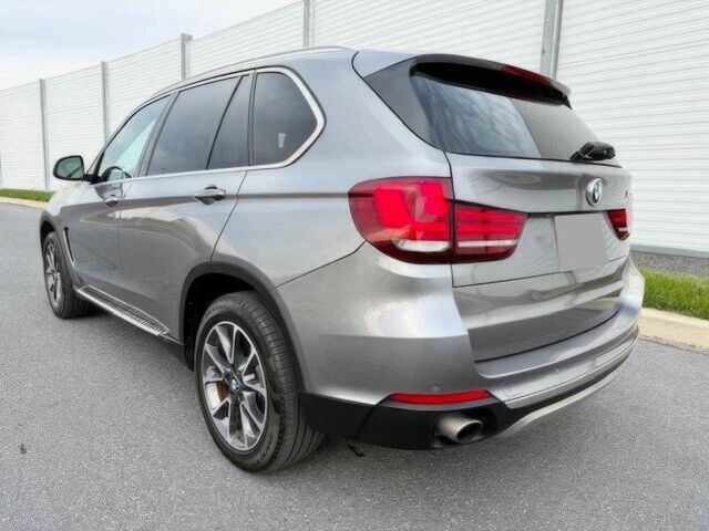 Серый БМВ Х5, объемом двигателя 3 л и пробегом 73 тыс. км за 6800 $, фото 6 на Automoto.ua