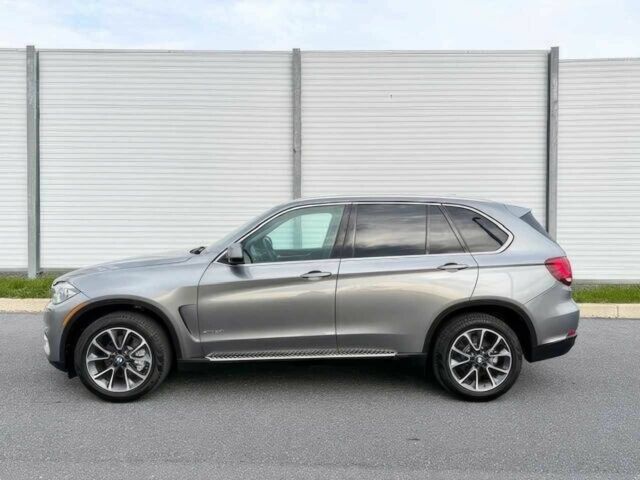 Серый БМВ Х5, объемом двигателя 3 л и пробегом 73 тыс. км за 6800 $, фото 2 на Automoto.ua