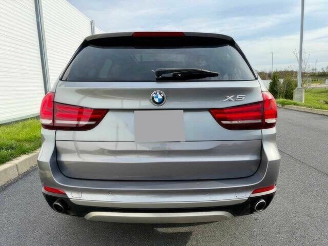 Серый БМВ Х5, объемом двигателя 3 л и пробегом 73 тыс. км за 6800 $, фото 5 на Automoto.ua