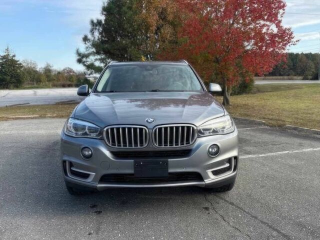Серый БМВ Х5, объемом двигателя 3 л и пробегом 58 тыс. км за 25000 $, фото 1 на Automoto.ua