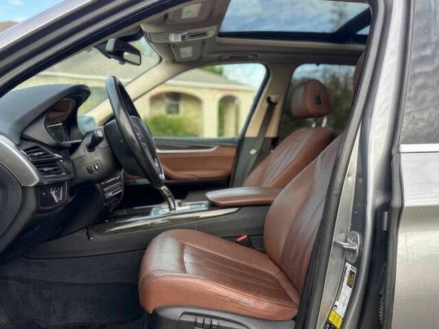 Серый БМВ Х5, объемом двигателя 3 л и пробегом 58 тыс. км за 25000 $, фото 5 на Automoto.ua