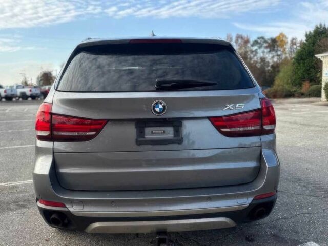 Серый БМВ Х5, объемом двигателя 3 л и пробегом 58 тыс. км за 25000 $, фото 4 на Automoto.ua