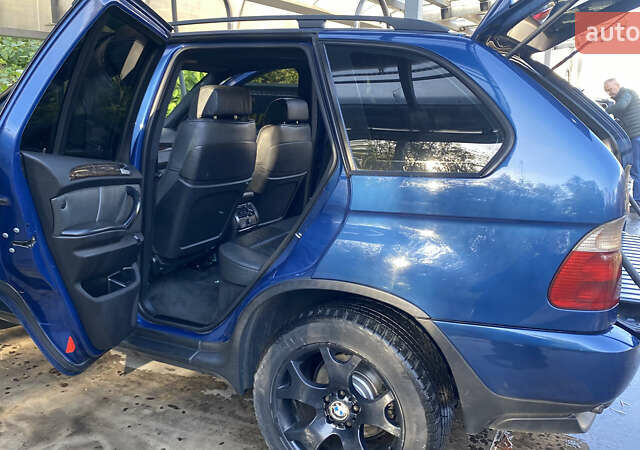 Синій БМВ Х5, об'ємом двигуна 4.4 л та пробігом 259 тис. км за 10000 $, фото 23 на Automoto.ua