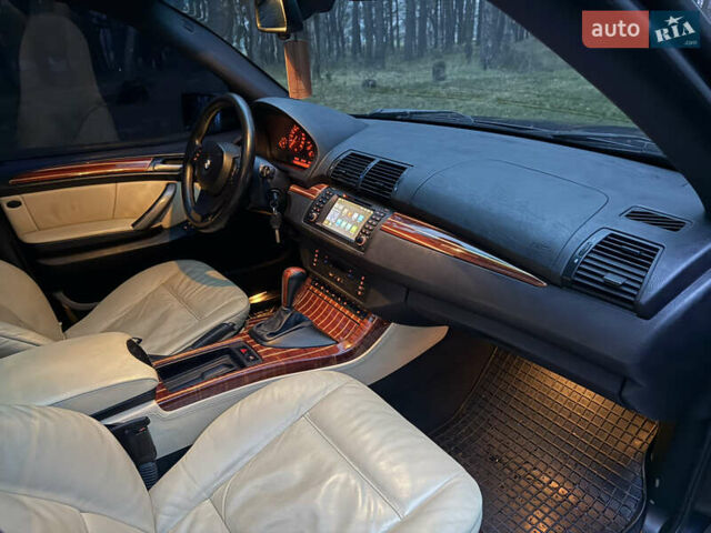 Синий БМВ Х5, объемом двигателя 3 л и пробегом 333 тыс. км за 9700 $, фото 15 на Automoto.ua