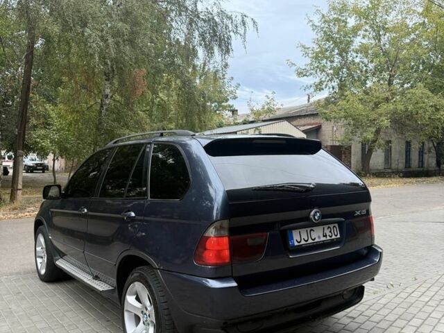 Синий БМВ Х5, объемом двигателя 3 л и пробегом 300 тыс. км за 5500 $, фото 5 на Automoto.ua