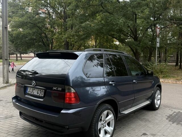 Синий БМВ Х5, объемом двигателя 3 л и пробегом 300 тыс. км за 5500 $, фото 4 на Automoto.ua