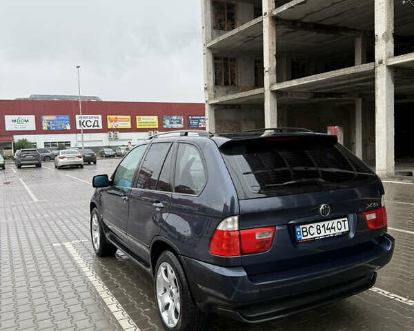 Синий БМВ Х5, объемом двигателя 2.99 л и пробегом 293 тыс. км за 11500 $, фото 4 на Automoto.ua