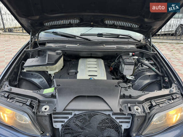 Синій БМВ Х5, об'ємом двигуна 3 л та пробігом 340 тис. км за 6299 $, фото 23 на Automoto.ua