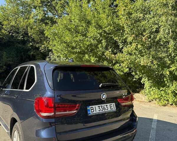 Синій БМВ Х5, об'ємом двигуна 3 л та пробігом 221 тис. км за 30000 $, фото 4 на Automoto.ua