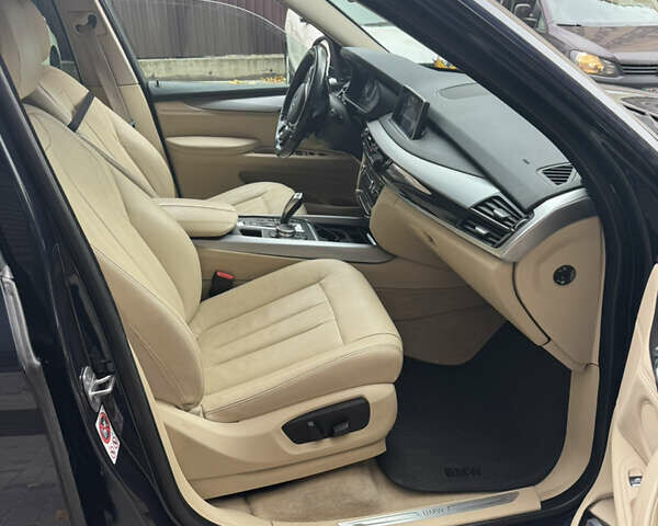 Синій БМВ Х5, об'ємом двигуна 2 л та пробігом 100 тис. км за 29999 $, фото 16 на Automoto.ua