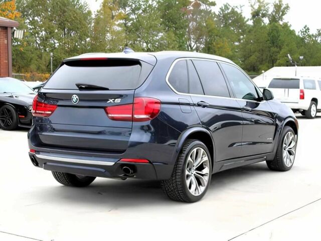 Синий БМВ Х5, объемом двигателя 3 л и пробегом 58 тыс. км за 17300 $, фото 4 на Automoto.ua