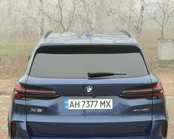 Синій БМВ Х5, об'ємом двигуна 3 л та пробігом 57 тис. км за 59999 $, фото 4 на Automoto.ua