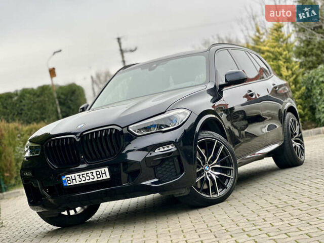 Синий БМВ Х5, объемом двигателя 3 л и пробегом 70 тыс. км за 51500 $, фото 1 на Automoto.ua