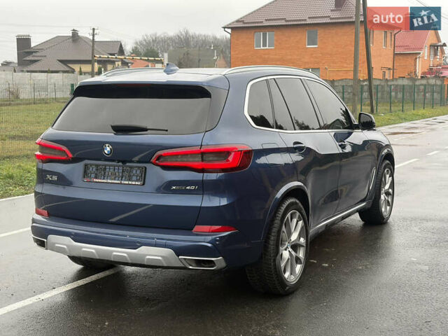 Синій БМВ Х5, об'ємом двигуна 3 л та пробігом 124 тис. км за 46000 $, фото 3 на Automoto.ua