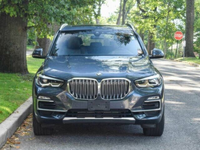 Синий БМВ Х5, объемом двигателя 3 л и пробегом 32 тыс. км за 24300 $, фото 1 на Automoto.ua