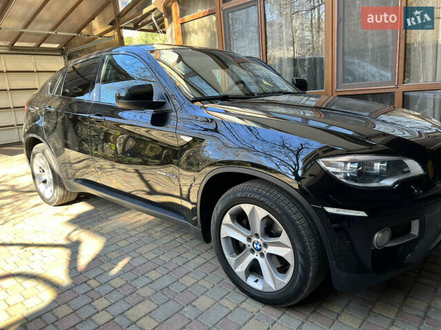 Черный БМВ Х6, объемом двигателя 3 л и пробегом 155 тыс. км за 29999 $, фото 1 на Automoto.ua