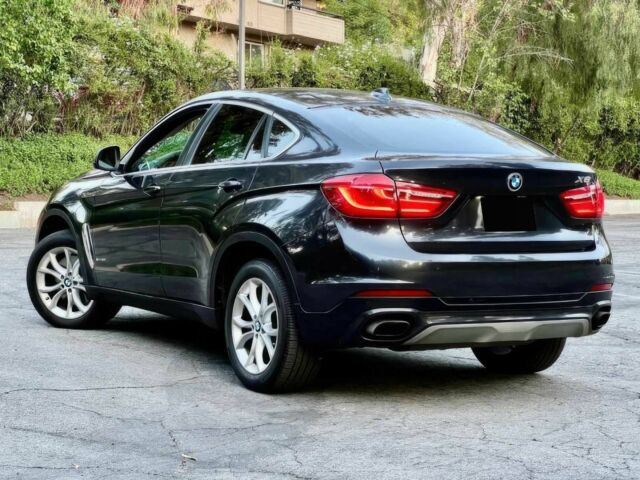 Черный БМВ Х6, объемом двигателя 4.4 л и пробегом 80 тыс. км за 16700 $, фото 3 на Automoto.ua