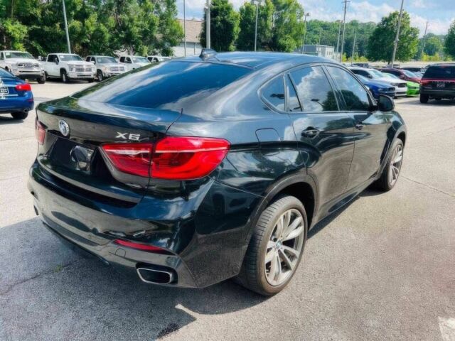 Чорний БМВ Х6, об'ємом двигуна 3 л та пробігом 75 тис. км за 13900 $, фото 4 на Automoto.ua