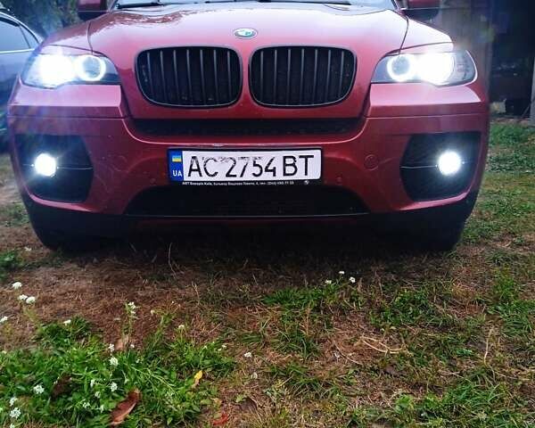 Красный БМВ Х6, объемом двигателя 3 л и пробегом 207 тыс. км за 15000 $, фото 2 на Automoto.ua