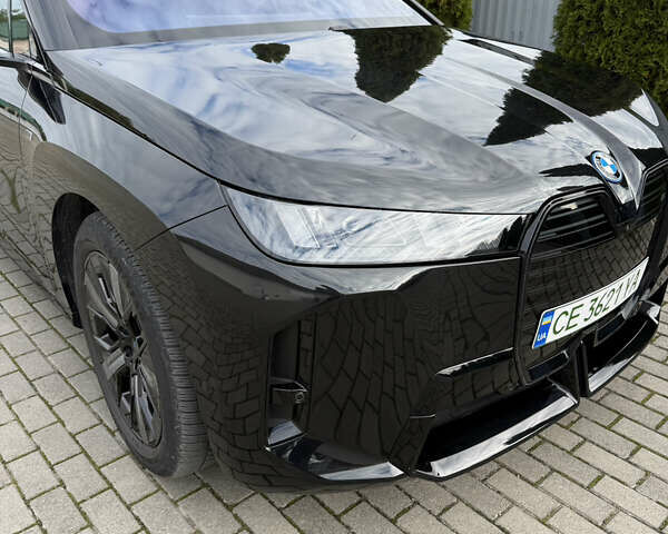 Черный БМВ iX, объемом двигателя 0 л и пробегом 40 тыс. км за 61088 $, фото 1 на Automoto.ua