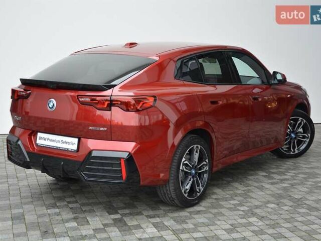 Красный БМВ iX2, объемом двигателя 0 л и пробегом 9 тыс. км за 53143 $, фото 2 на Automoto.ua