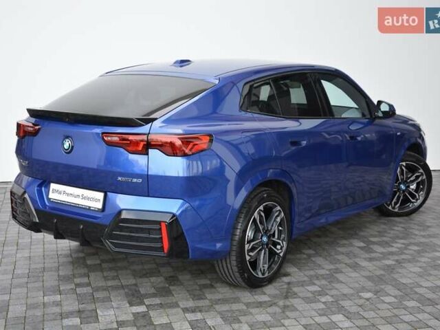 Синий БМВ iX2, объемом двигателя 0 л и пробегом 3 тыс. км за 52261 $, фото 2 на Automoto.ua