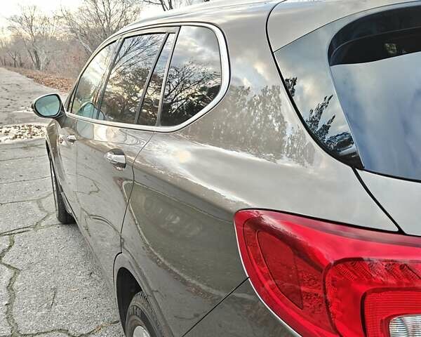 Коричневый Бьюик Envision, объемом двигателя 2.46 л и пробегом 141 тыс. км за 15000 $, фото 3 на Automoto.ua