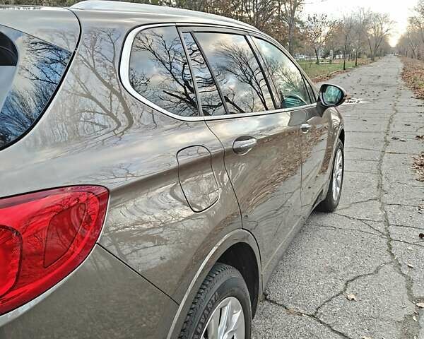 Коричневый Бьюик Envision, объемом двигателя 2.46 л и пробегом 141 тыс. км за 15000 $, фото 4 на Automoto.ua