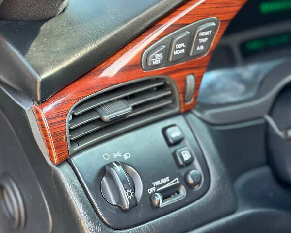 Черный Кадиллак ДеВиль, объемом двигателя 4.57 л и пробегом 150 тыс. км за 6555 $, фото 19 на Automoto.ua