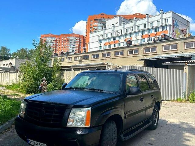 Черный Кадиллак Эскалейд, объемом двигателя 6 л и пробегом 100 тыс. км за 13200 $, фото 1 на Automoto.ua