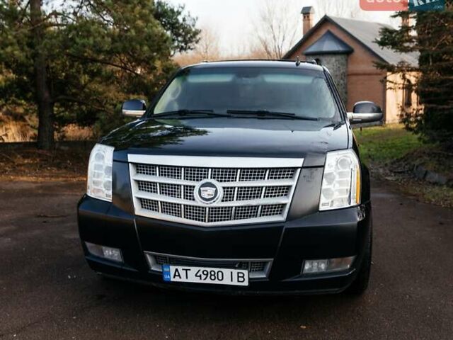 Чорний Каділак Ескалейд, об'ємом двигуна 6.16 л та пробігом 250 тис. км за 26999 $, фото 4 на Automoto.ua
