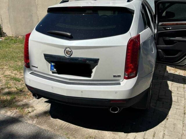 Білий Каділак SRX, об'ємом двигуна 3.6 л та пробігом 140 тис. км за 13000 $, фото 1 на Automoto.ua