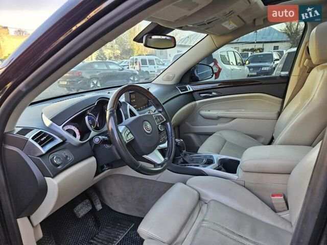 Чорний Каділак SRX, об'ємом двигуна 2.99 л та пробігом 209 тис. км за 11900 $, фото 5 на Automoto.ua